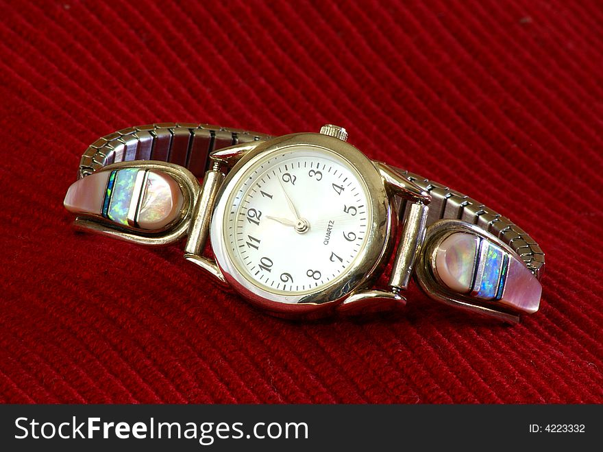 Lady's jewelry wrist watch with opal and mother of pearl gemstones. Lady's jewelry wrist watch with opal and mother of pearl gemstones.