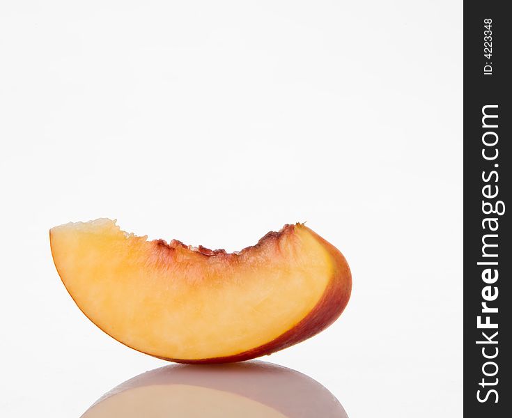 Juicy delicious fresh peach on white background. Juicy delicious fresh peach on white background