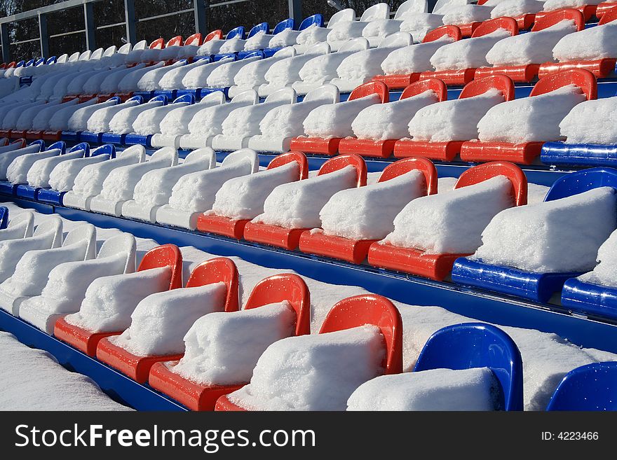 Seats on tribunes of stadium under a snow. Seats on tribunes of stadium under a snow