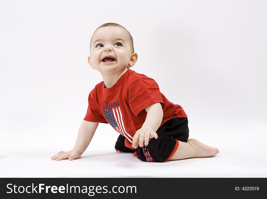 Curious baby in red t shirt. Curious baby in red t shirt
