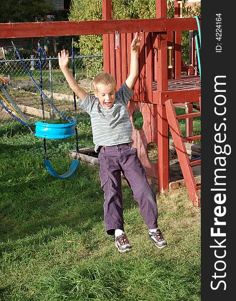 Small Boy wanted Mom to watch him jump out of the swing. He kept doing it until he did the best one. Small Boy wanted Mom to watch him jump out of the swing. He kept doing it until he did the best one.