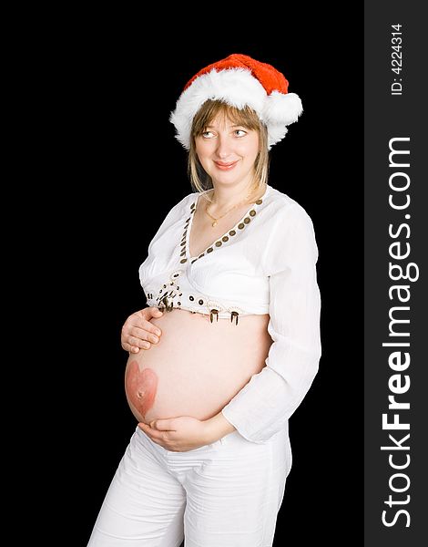 A pregnant lady in a Christmas hat with a black background