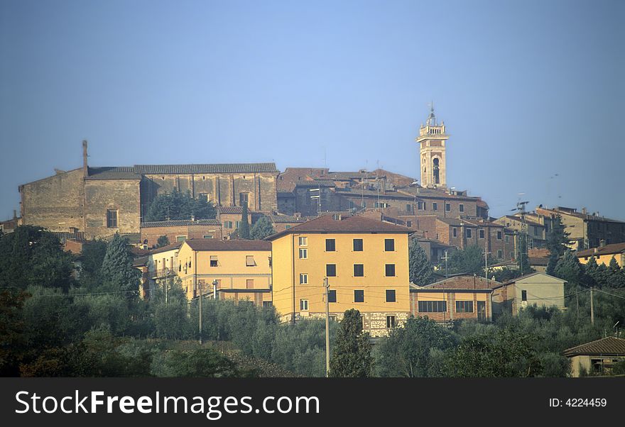 Little italian town at the top of the hill with tower, dawn. Little italian town at the top of the hill with tower, dawn