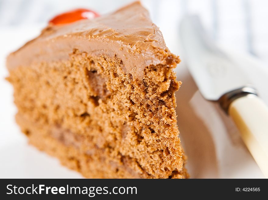 A close up of a thick wedge of tasty chocolate cake. A close up of a thick wedge of tasty chocolate cake