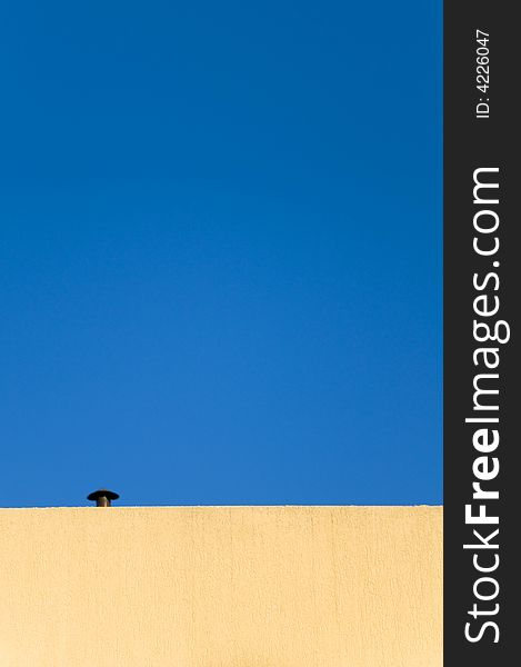 Smoke stack on top of the building.