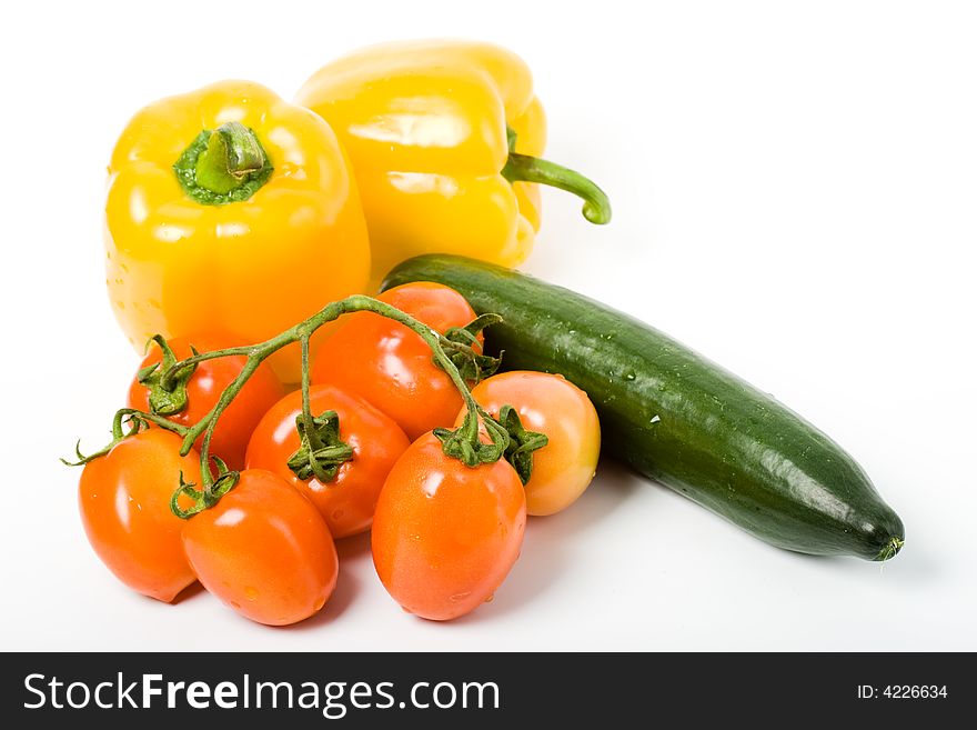 Yellow sweet pepper red tomato and green cucumber. Yellow sweet pepper red tomato and green cucumber