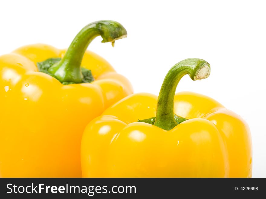 Two isolated yellow sweet peppers. Two isolated yellow sweet peppers