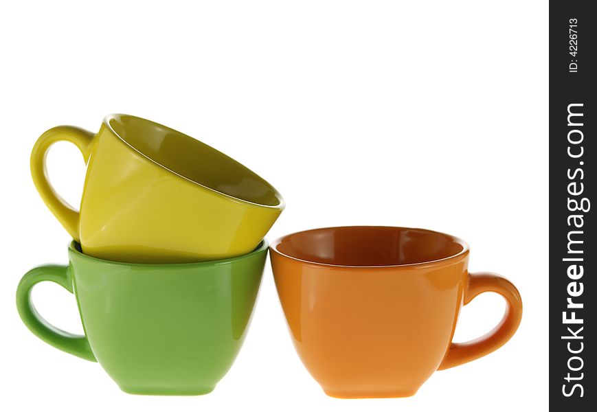 Three color cups. Ceramic service from color cups