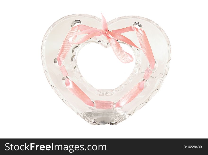 Heart-shaped crystal frame for photo with pink ribbon and bow isolated on white background. Heart-shaped crystal frame for photo with pink ribbon and bow isolated on white background