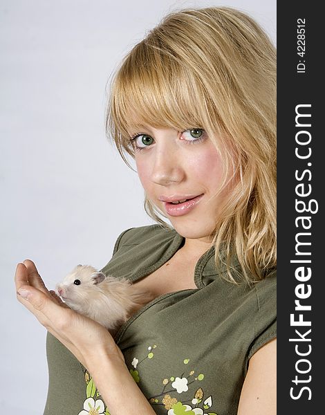 Portrait of young blonde beautiful girl with a mouse. Portrait of young blonde beautiful girl with a mouse
