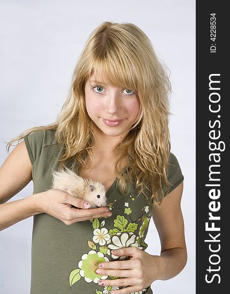 Portrait of young blonde beautiful girl with a mouse. Portrait of young blonde beautiful girl with a mouse