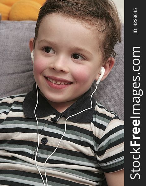 The cheerful boy in headphones