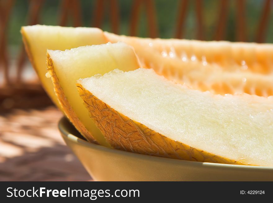 Melon slices. Shallow dof, focus is on the corner of the nearest slice.