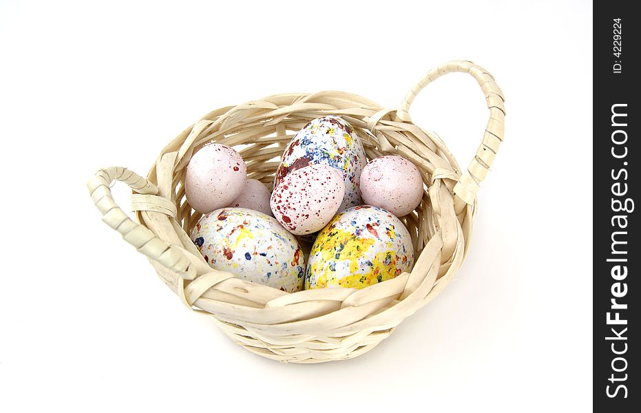 Basket of candy eggs in various colors