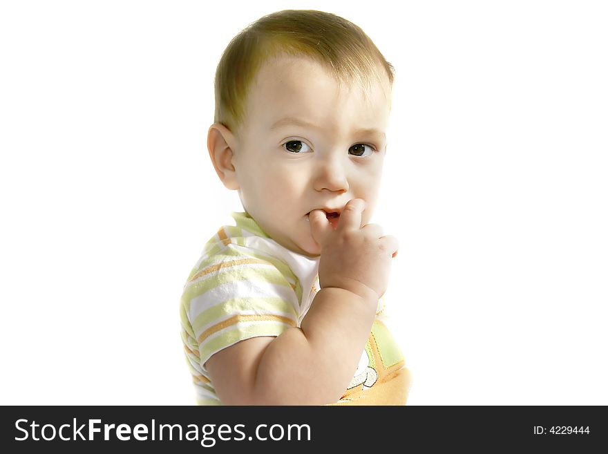 Baby boy with finger in his mouth over white