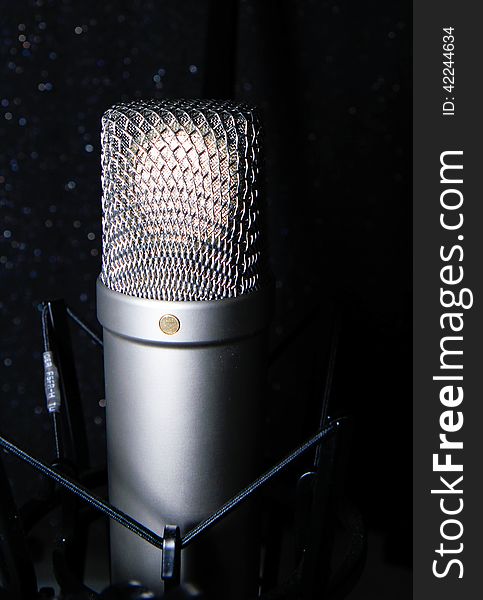 Studio microphone on black background