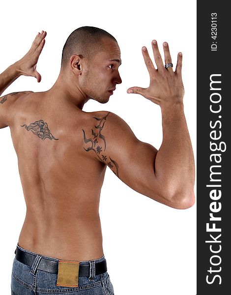 Young man showing his muscles and his tattooed back - isolated over white!. Young man showing his muscles and his tattooed back - isolated over white!