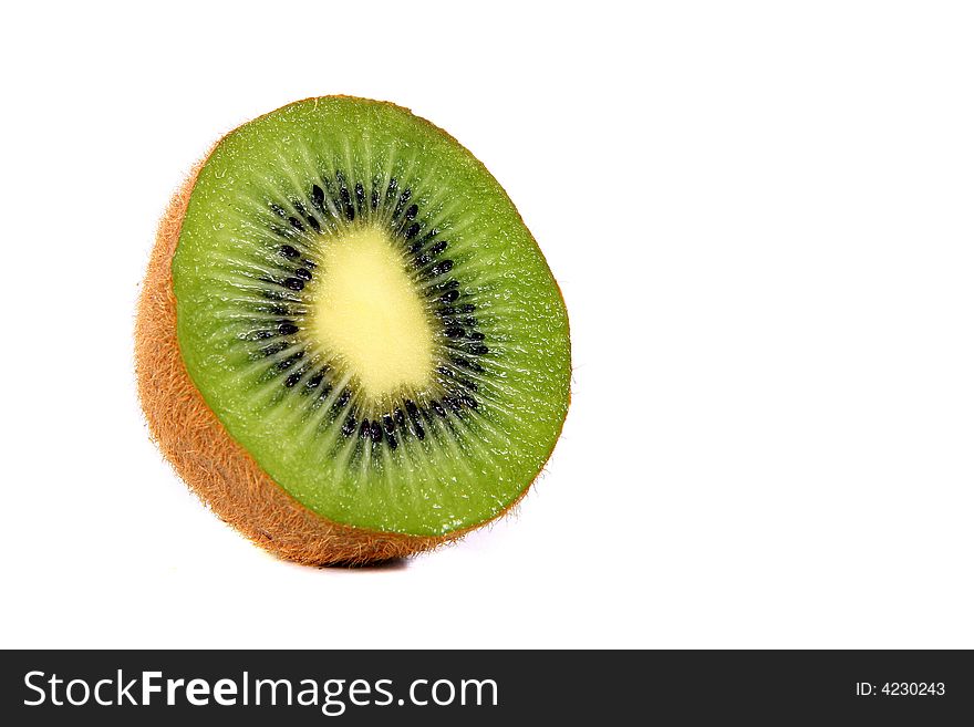 Shot of a kiwi - wet and juicy - over white background. Shot of a kiwi - wet and juicy - over white background.