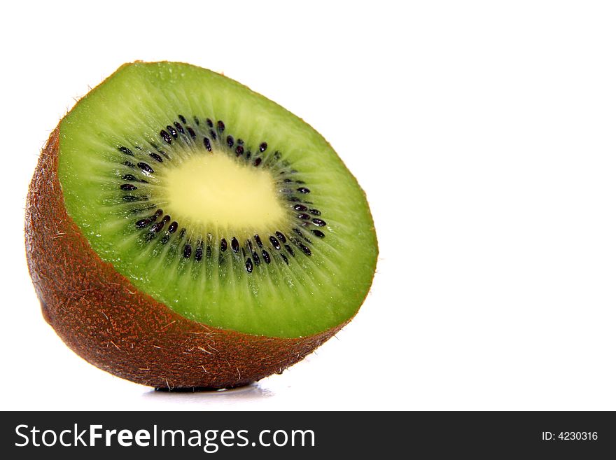 Shot of a kiwi - wet and juicy - over white background.