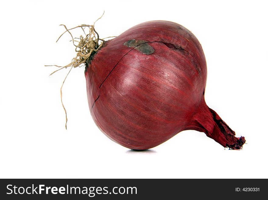 Red onions cut in half over white background.