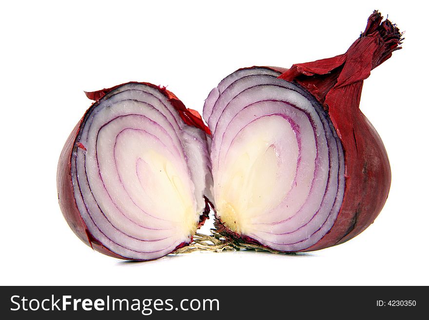 Red onions cut in half over white background.