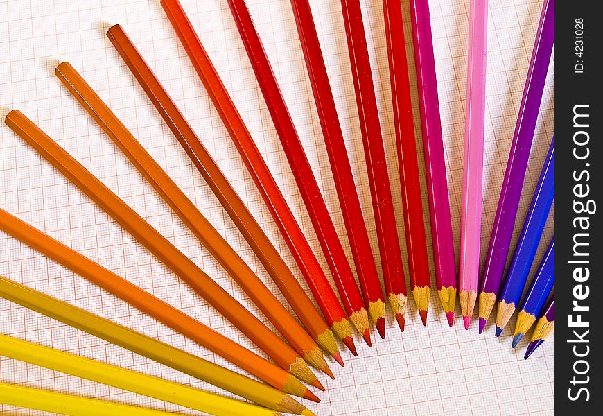 Arrangement of coloured pencils on graph paper. Arrangement of coloured pencils on graph paper