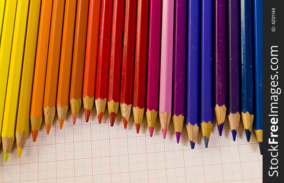 Arrangement of coloured pencils on graph paper. Arrangement of coloured pencils on graph paper