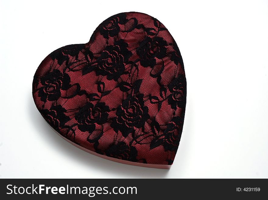 A red and black lace valentine box on a white background. A red and black lace valentine box on a white background.