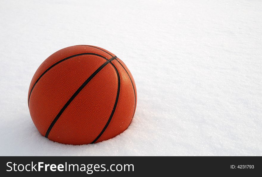 The basketball ball on the snow