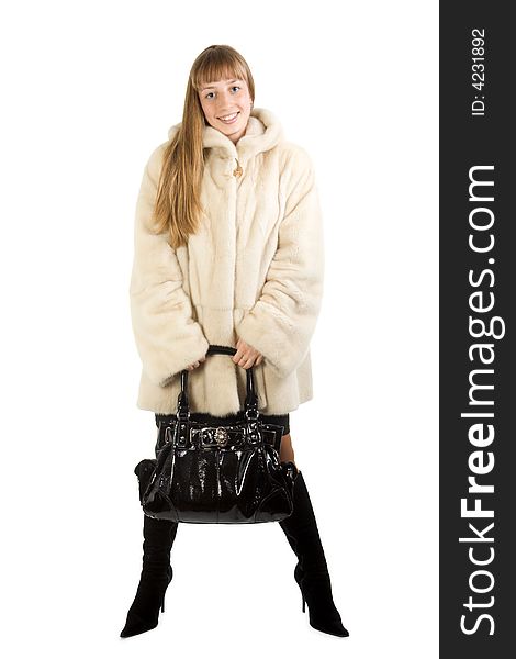 Pretty young girl in fur jacket taking bag. Isolate on white.
