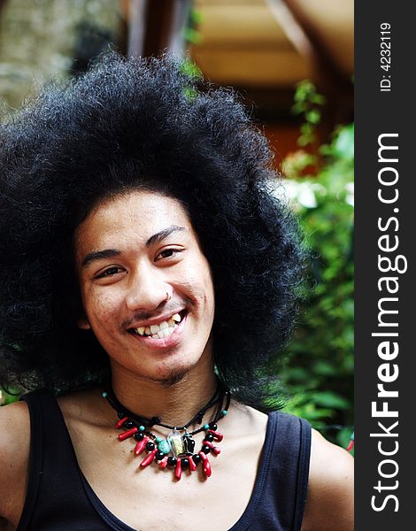 Portrait of a Thai man with a big afro.