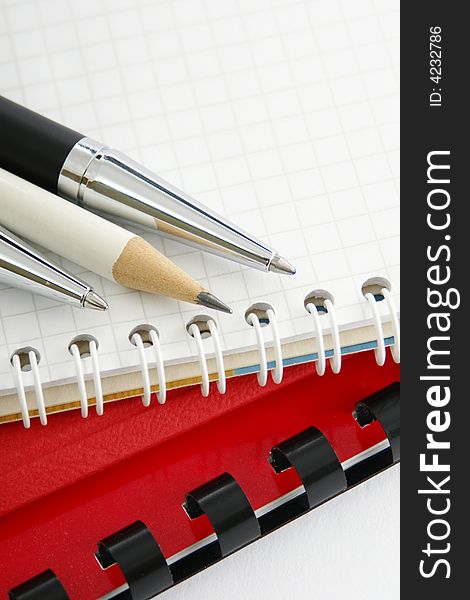 Notebook with a ball-point pen and pencil. Notebook with a ball-point pen and pencil