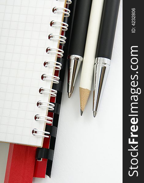 Notebook with a ball-point pen and pencil. Notebook with a ball-point pen and pencil