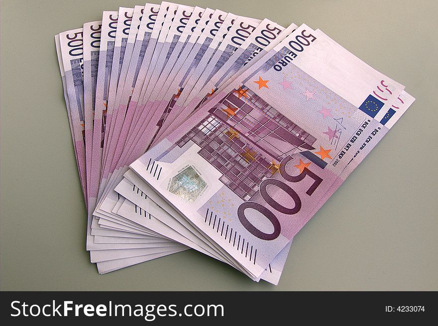 Pack of EURO banknotes on grey background. Money. Pack of EURO banknotes on grey background. Money.