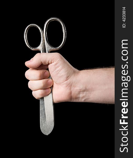 Scissors in a hand