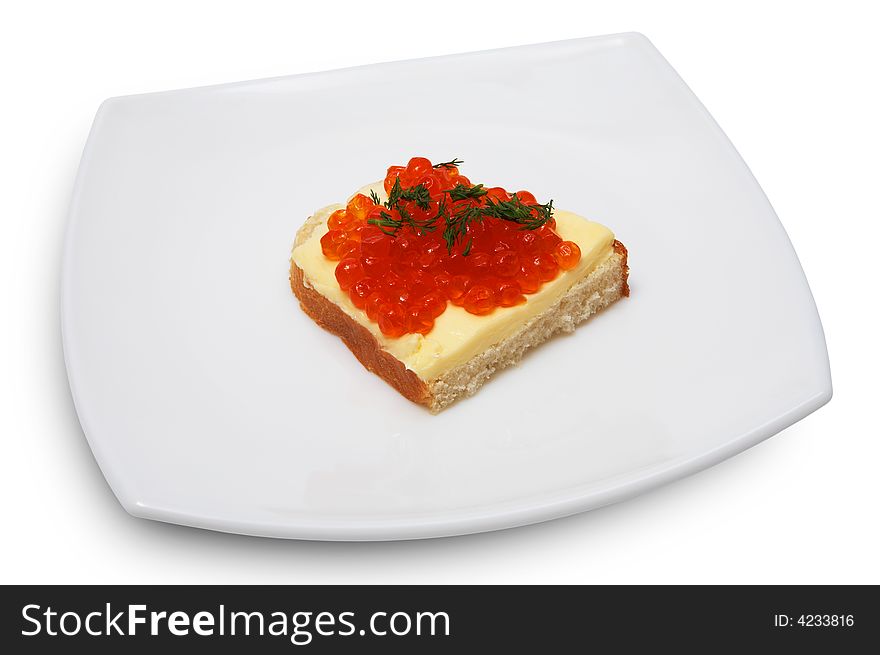 Sandwich with red caviar on a white plate
