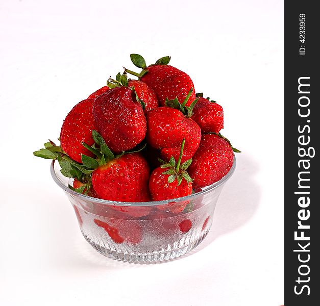 Strawberry in the bowl isolated on the white backround