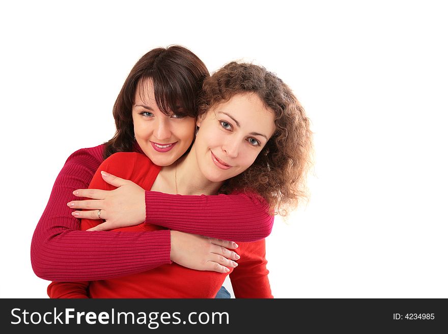 Two girls embraces on white