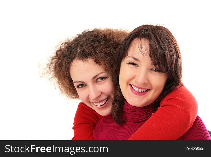 Two girls embraces on white