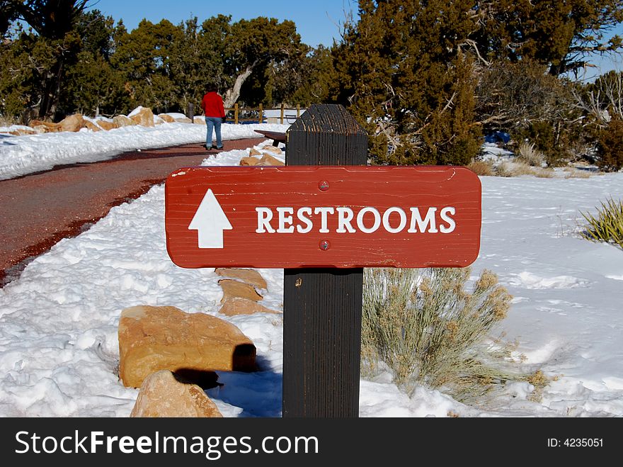 Sign pointing to restrooms