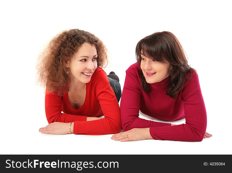 Two girls lying on white