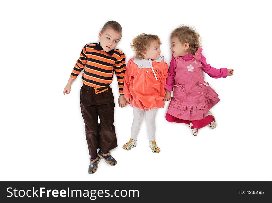 Three children lying top view on white 2. Three children lying top view on white 2