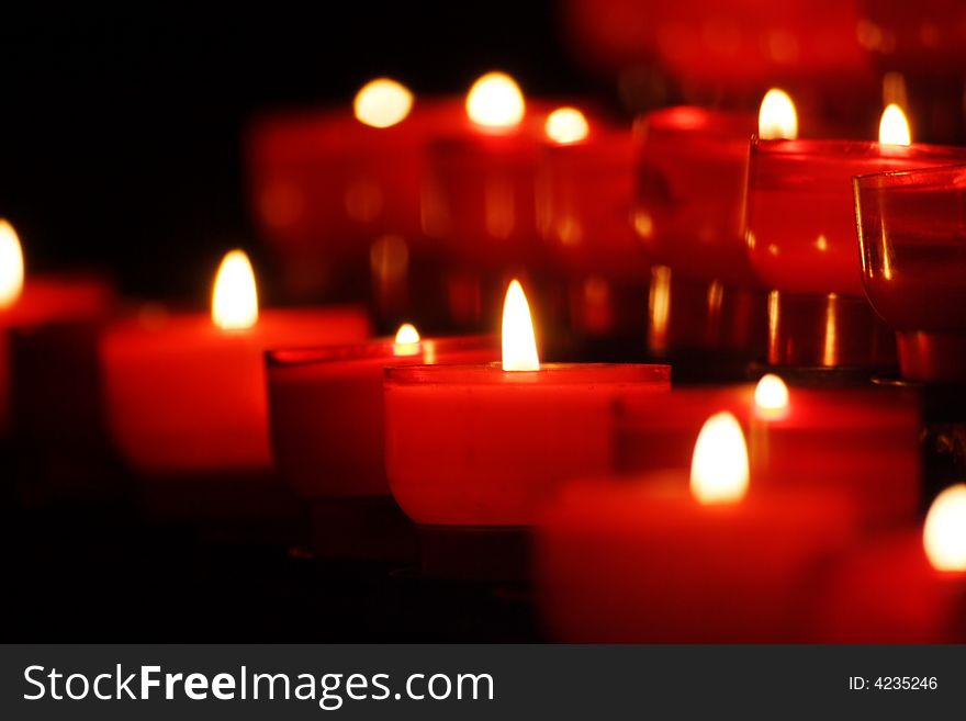 Small candles in rows in a church