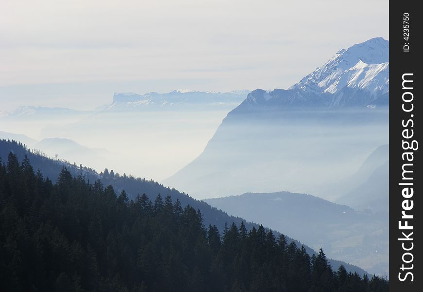 Mountain landscape fog drill cloud Alps altittude white snows mount
