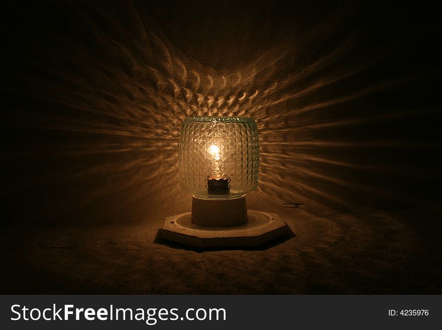 The photo of a lamp is interesting by the symmetry