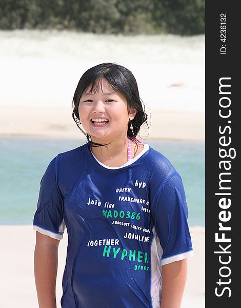 Korean teen girl enjoys the beach and water