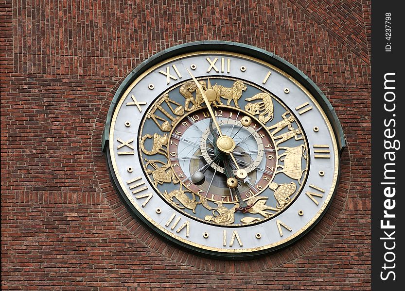 An interesting clock on the side of the Town hall in Oslo, Norway. An interesting clock on the side of the Town hall in Oslo, Norway