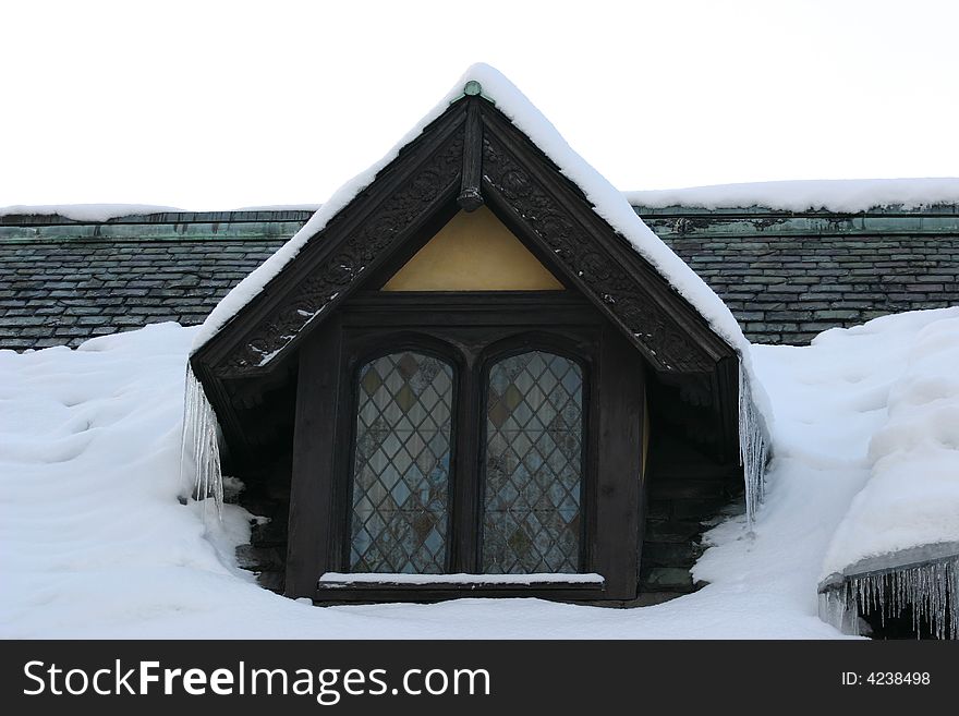 Snow on a rooftop with window. Snow on a rooftop with window