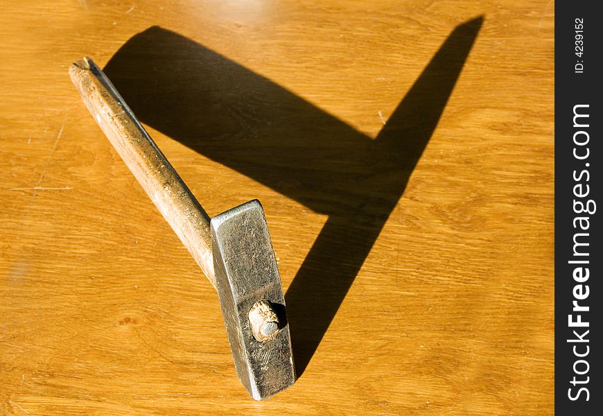 Shadow of a hammer as the letter Y. Shadow of a hammer as the letter Y