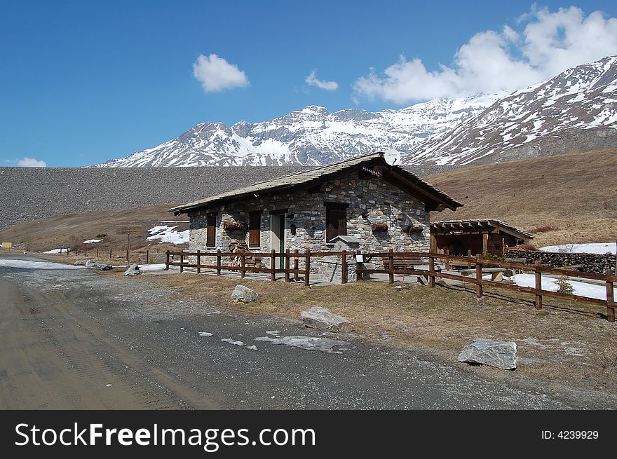 A mountain chalet near a dam